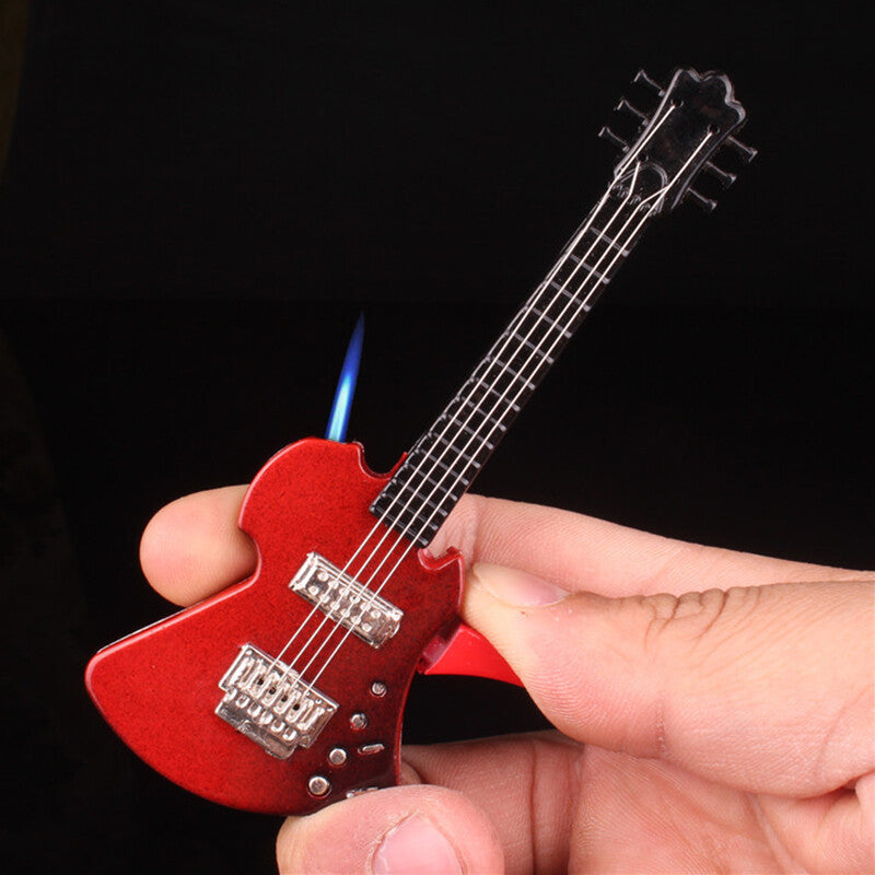 Red and silver guitar-shaped cigarette torch lighter with black strings held in hand