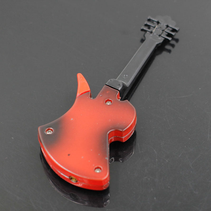 Red and black guitar-shaped cigarette torch lighter with silver hardware